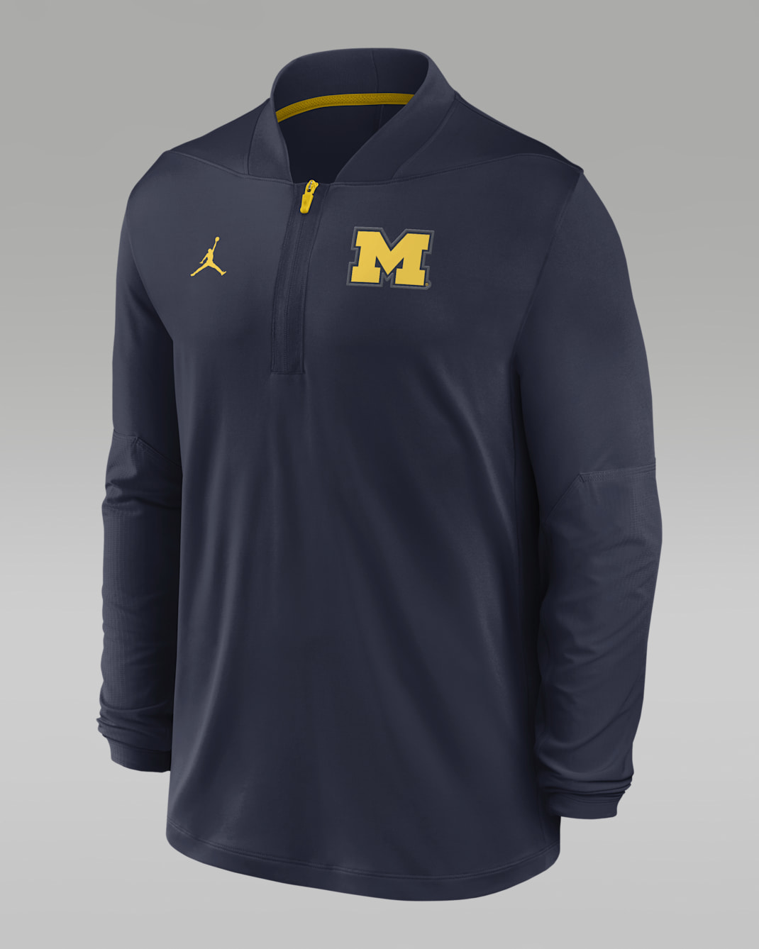 Playera universitaria marca Jordan Dri-FIT de medio cierre para hombre Michigan Sideline - Azul marino universitario/Amarillo