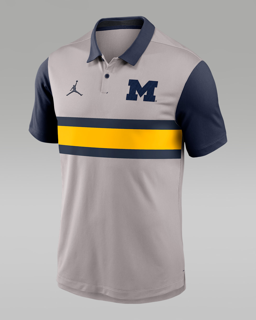 Polo universitario marca Jordan Dri-FIT para hombre Michigan Vapor - Gris