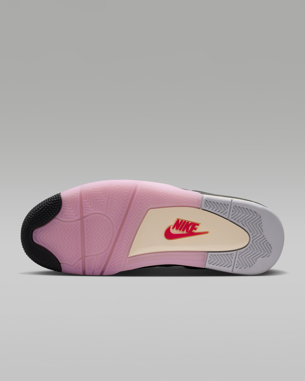 Air Jordan 4 Retro Comic sole detail showing black cream and pink midsole with pink outsole