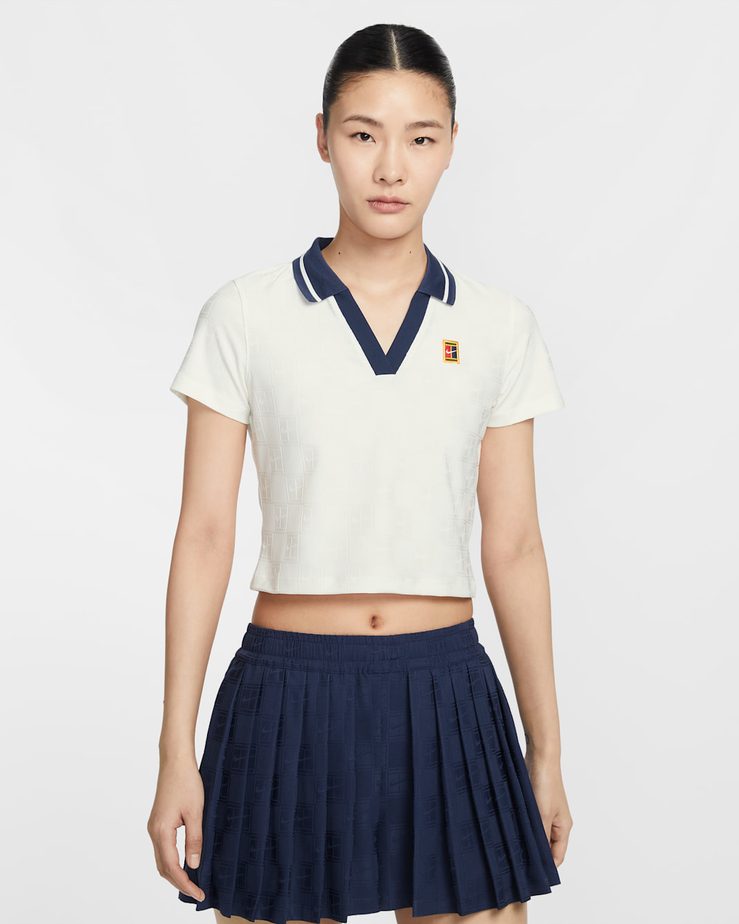 เสื้อเทนนิสโปโลเอวลอยผู้หญิงคอลเลกชัน Dri-FIT NikeCourt Court - Sail/Midnight Navy