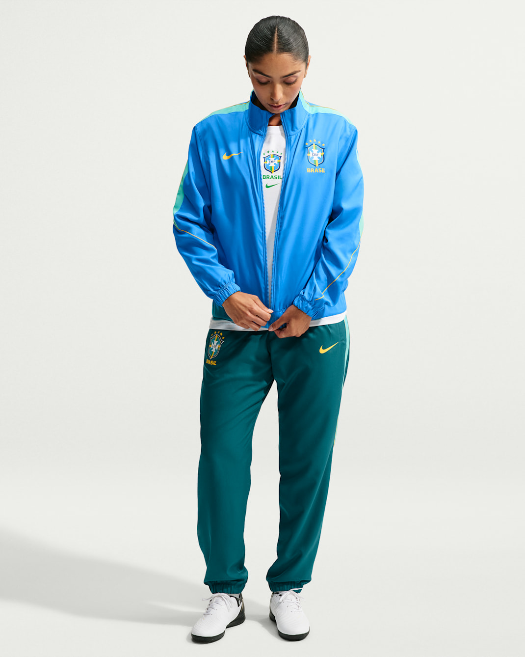 Brazil Strike Women's Nike Dri-FIT Soccer Woven Tracksuit - Light Photo Blue/Geode Teal/Light Menta/Midwest Gold