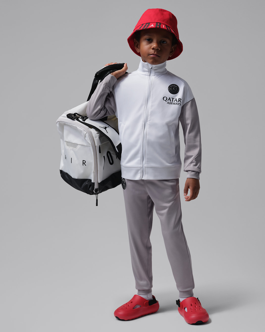 Paris Saint-Germain Strike Night Edition Younger Kids' Jordan Dri-FIT Football Knit Tracksuit - White/Atmosphere Grey/Black