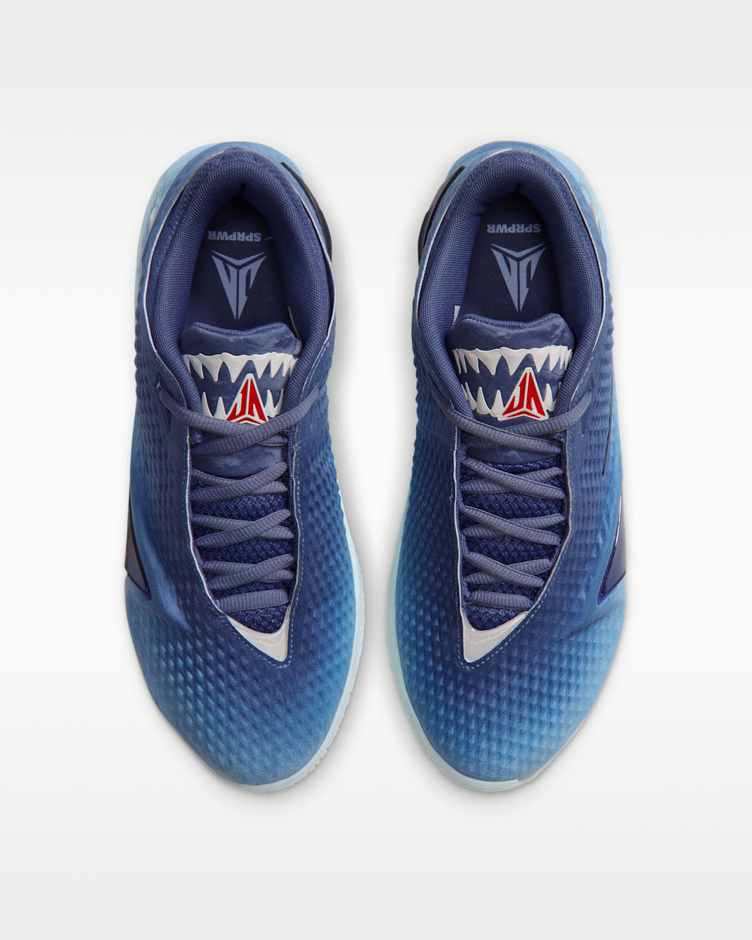 Nike Ja 4 Jaws detail showing shimmering dark blue JA-plate hardware and textured upper