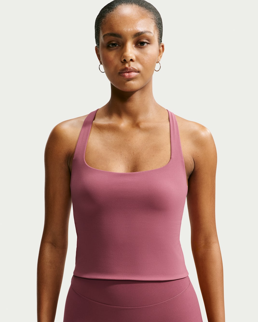 Camiseta de tirantes con bra deportivo de baja sujeción para mujer Nike Zenvy - Rosa humo/Blanco