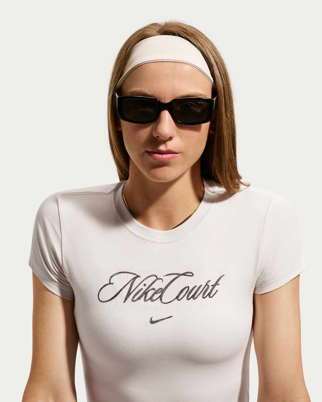 Playera de tenis de manga corta para mujer NikeCourt Heritage - Tiza