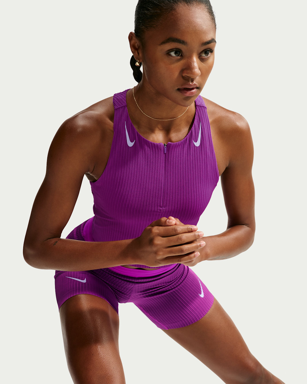 Débardeur court de running avec poches Dri-FIT ADV Nike AeroSwift pour femme - Vivid Purple/Purple Pulse