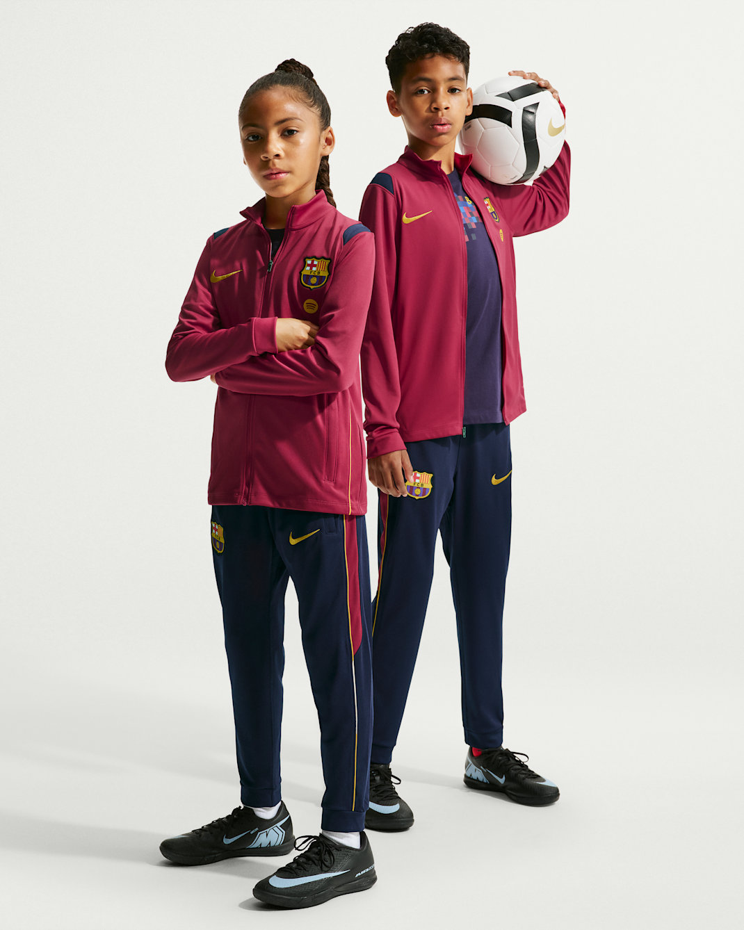 F.C. Barcelona Academy Pro Older Kids' Nike Dri-FIT Football Knit Tracksuit - Noble Red/Blackened Blue/Mineral Yellow