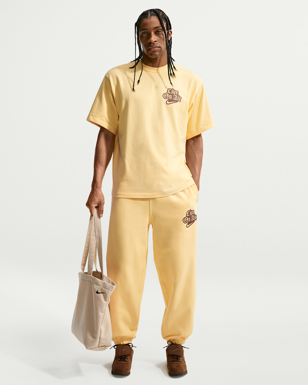 Nike Solo Swoosh Fleece-Hose mit Bündchen (Herren) - Soft Yellow