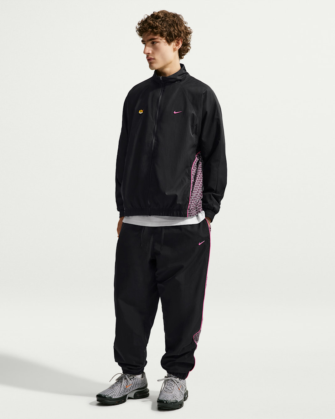 Pantaloni in tessuto Nike Sportswear – Uomo - Nero/Nero/Pinksicle