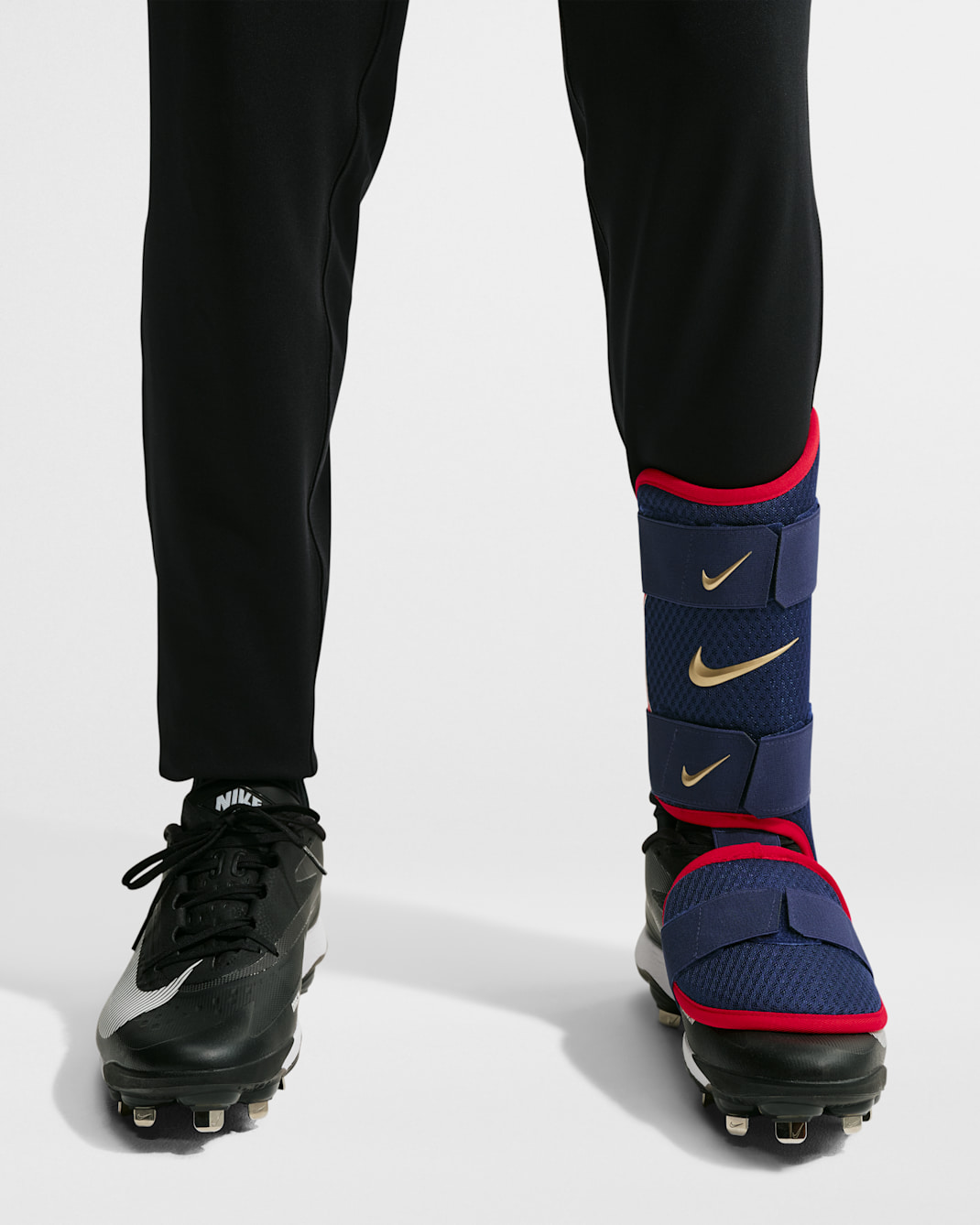 Protección de pierna para bateador de béisbol Nike Diamond (bateador zurdo) - Azul vacío/Pimiento/Oro metalizado