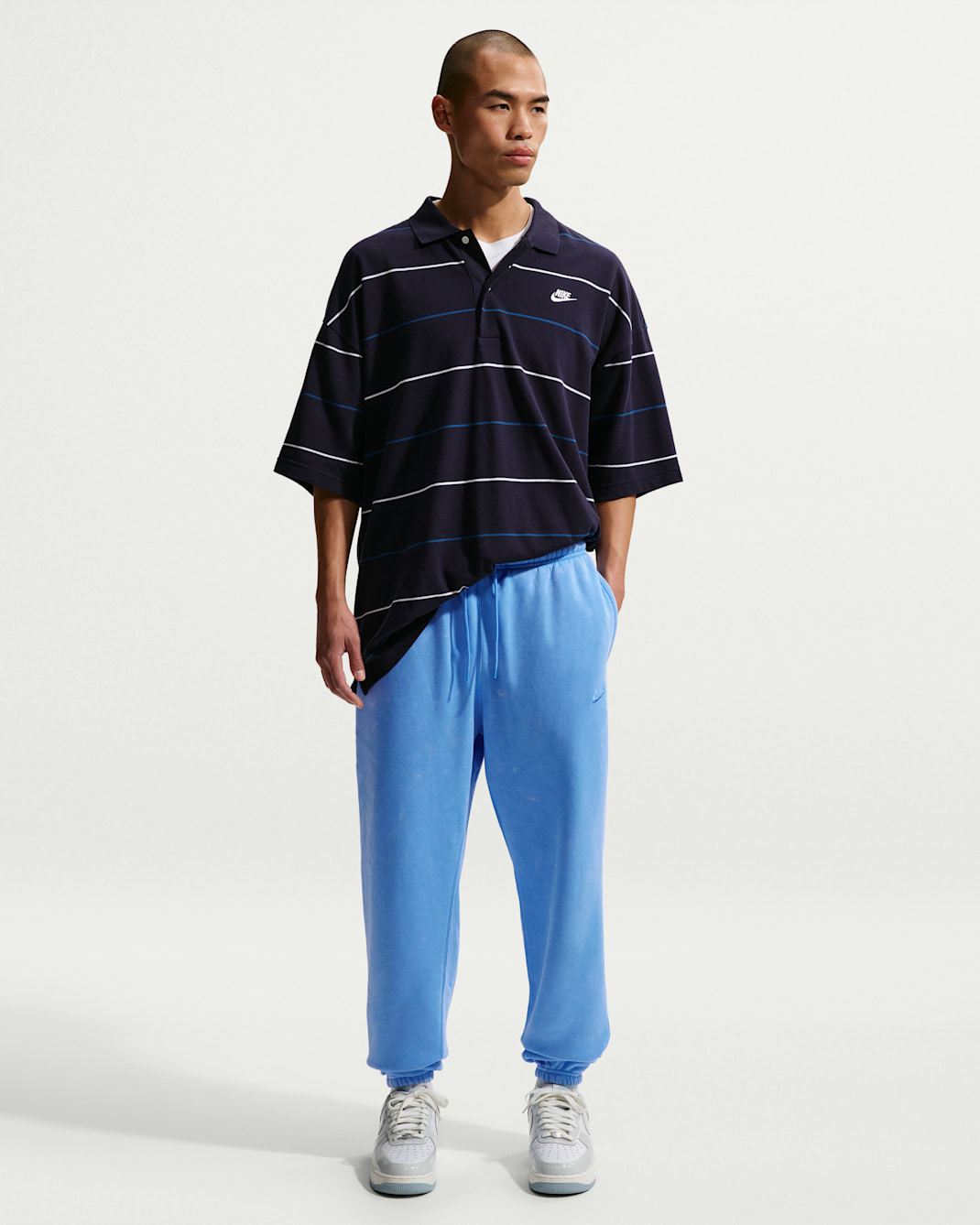 Pants de tejido Fleece con puño con efecto lavado para hombre Nike Sportswear Club - Azul universitario/Azul universitario