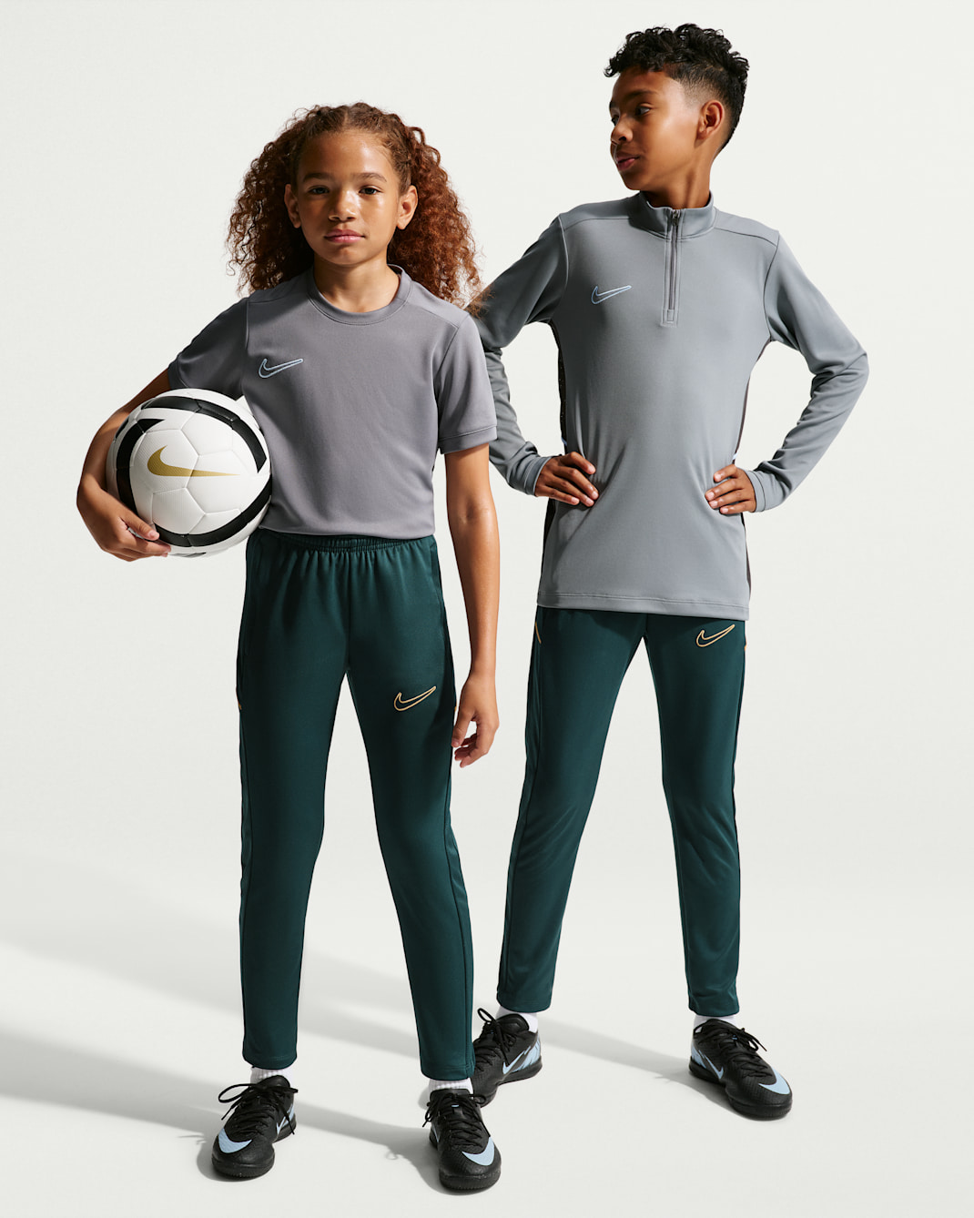 Nike Academy Older Kids' Dri-FIT Football Pants - Midnight Spruce/Midnight Spruce/Elemental Gold/Metallic Gold