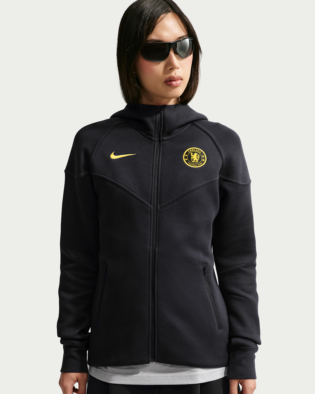 Damska bluza do piłki nożnej z kapturem i zamkiem na całej długości Nike Chelsea F.C. Tech Fleece Windrunner - Pitch Blue/Midwest Gold