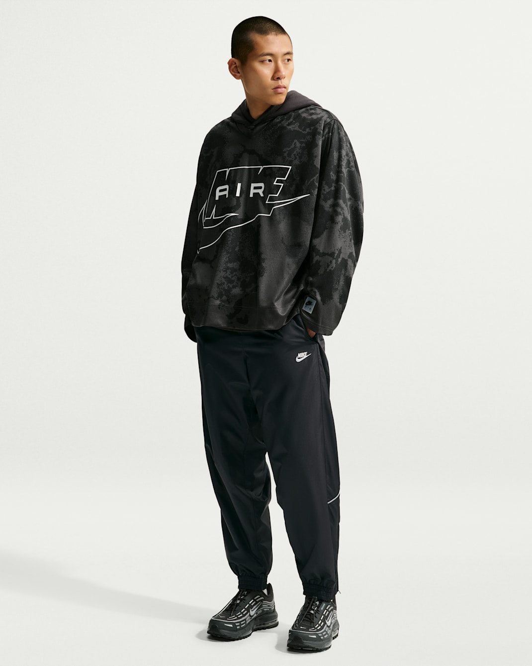 Pantalon à l'épreuve des intempéries Nike Windrunner pour homme - Noir/Noir/Blanc