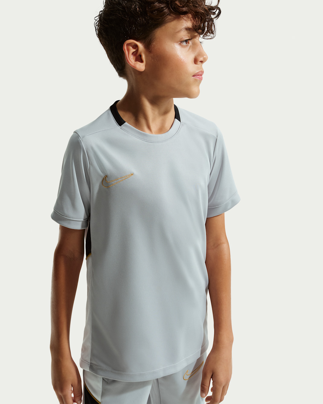 Nike Academy Older Kids' Dri-FIT Football Top - Light Smoke Grey/Black/White/Metallic Gold