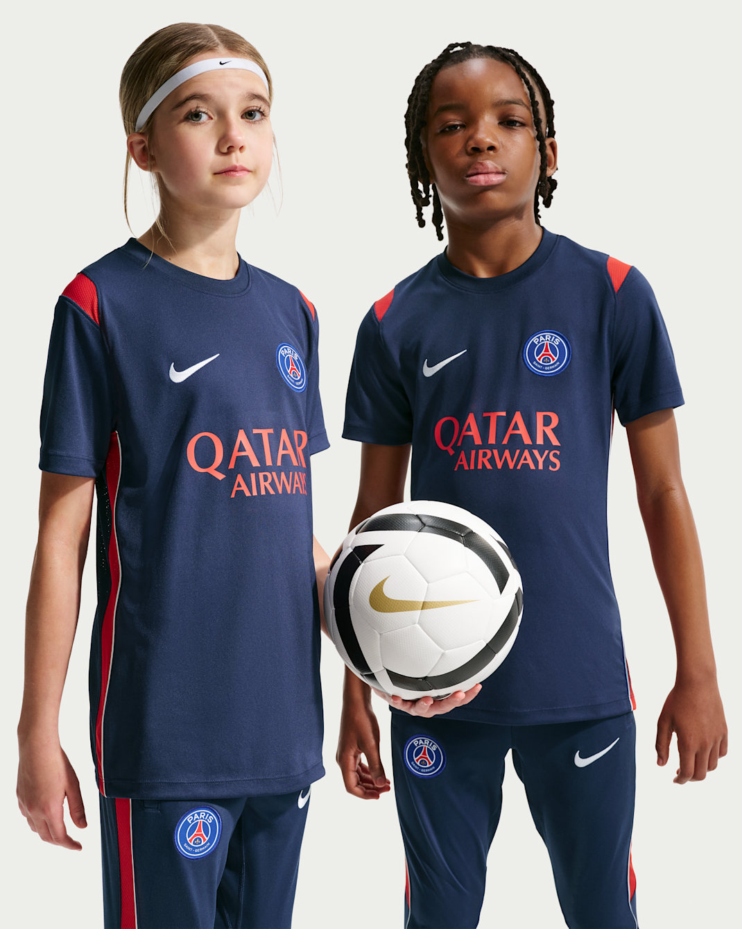 Paris Saint-Germain Academy Pro Older Kids' Nike Dri-FIT Football Short-Sleeve Knit Top - Midnight Navy/University Red/White/White