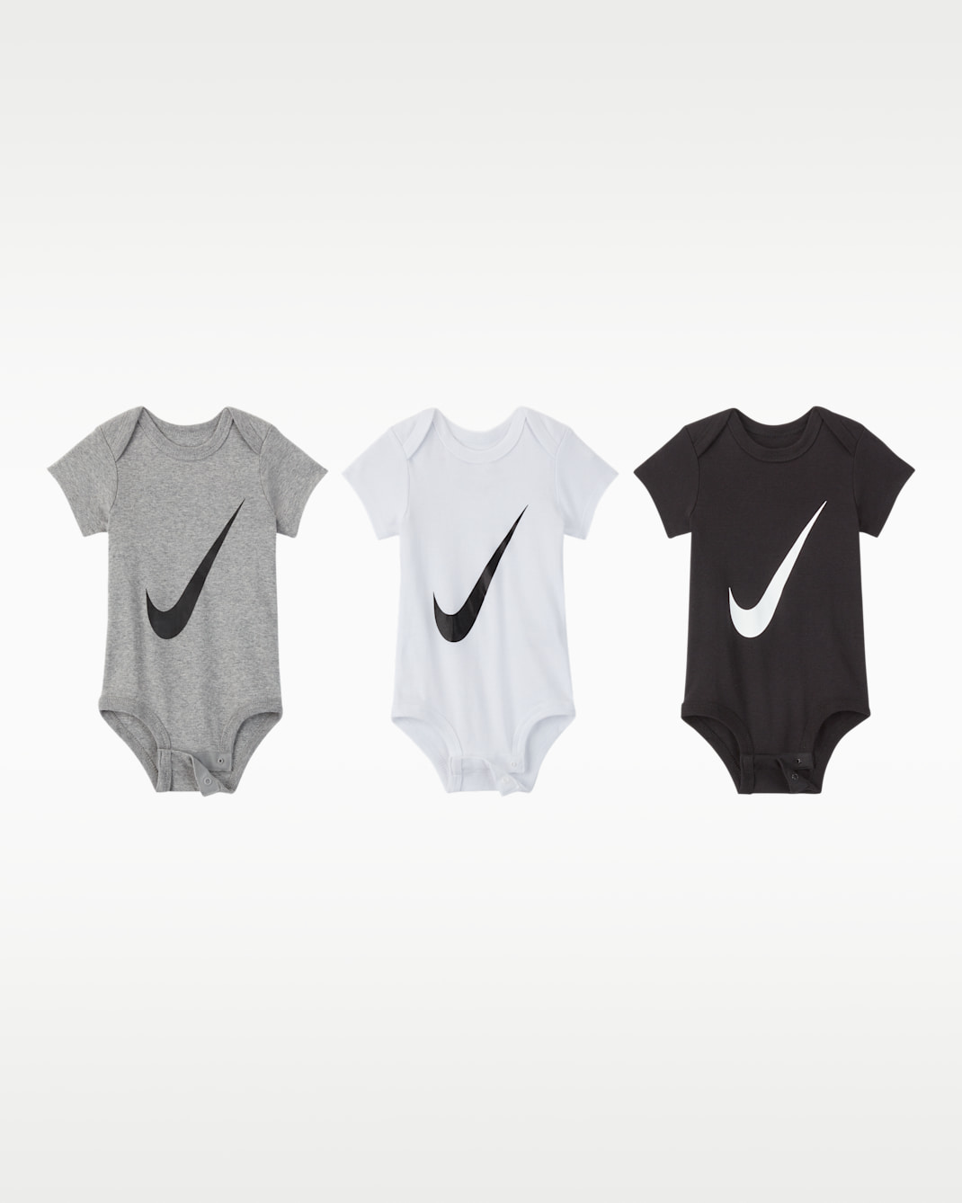 Lot de trois bodys Nike pour bébé (0 - 6 mois) - Blanc