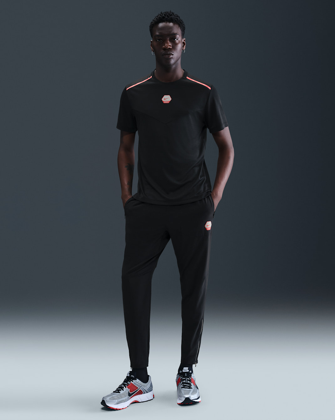 Nike Sportswear City Side løpebukser til herre - Svart/Light Crimson