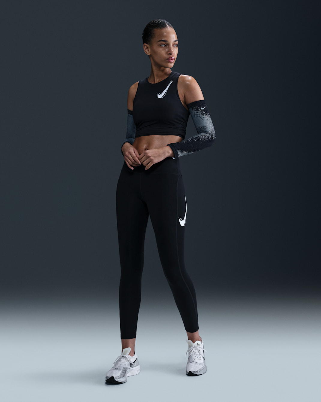 Leggings de tiro medio de 7/8 para mujer Nike Fast - Negro