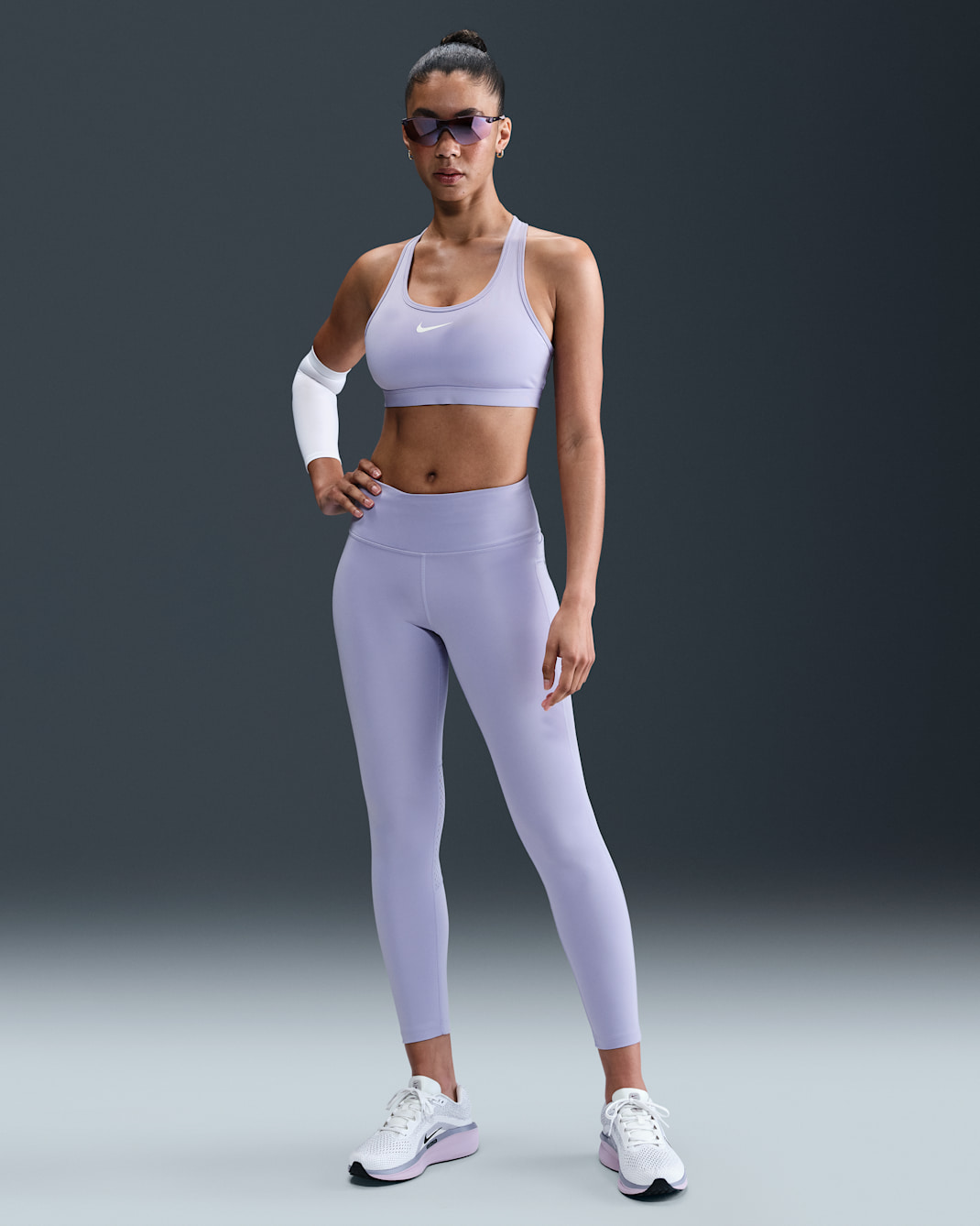 Leggings de tiro medio de 7/8 para mujer Nike Fast - Hielo lila