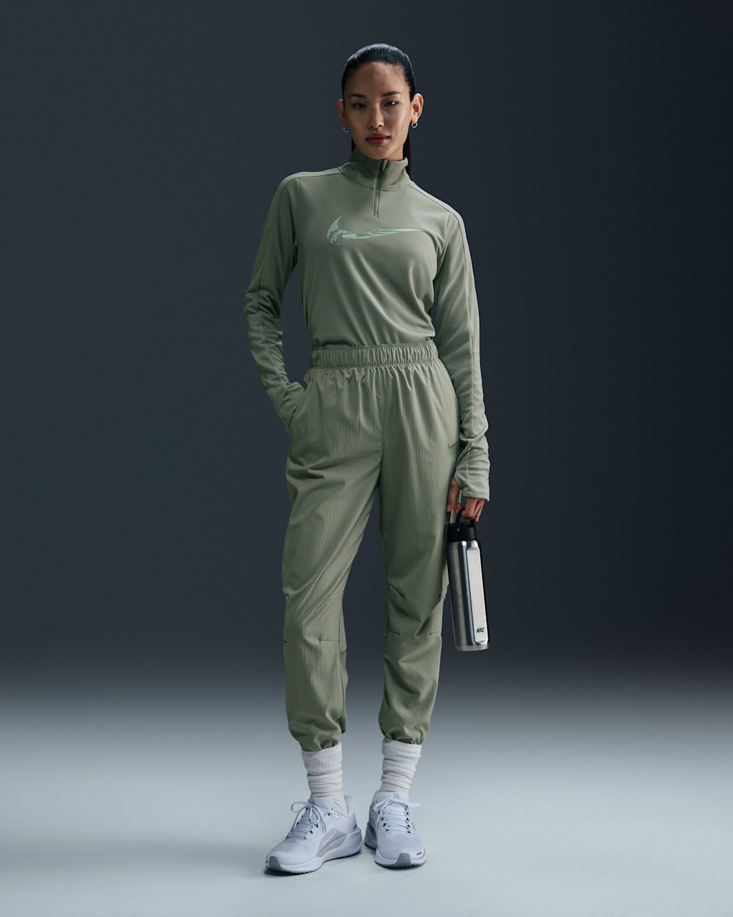 Nike Dri-FIT Fast-opvarmningsbukser i 7/8 længde med mellemhøj talje til kvinder - Jade Horizon