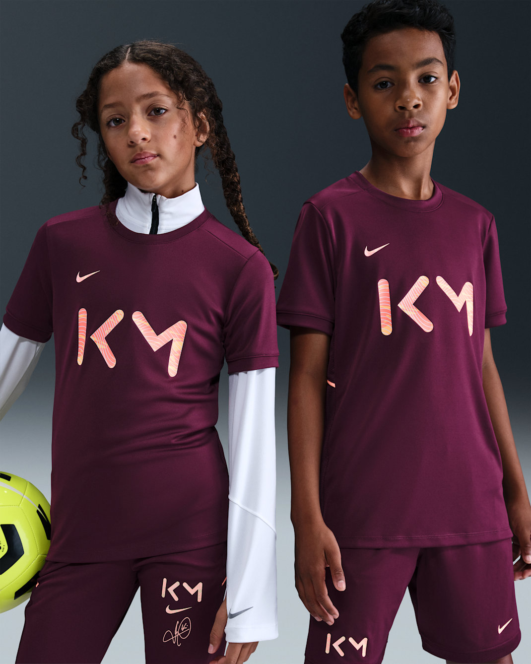 Kylian Mbappé Academy Older Kids' Nike Dri-FIT Football Short-Sleeve Top - Bordeaux/Bordeaux/Orange Pulse/Melon Tint
