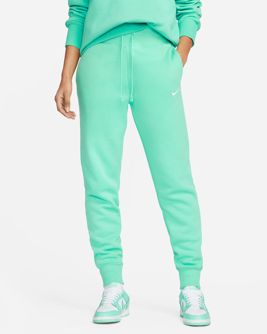 Joggers de tiro alto para mujer Nike Sportswear Phoenix Fleece - Menta claro/Vela