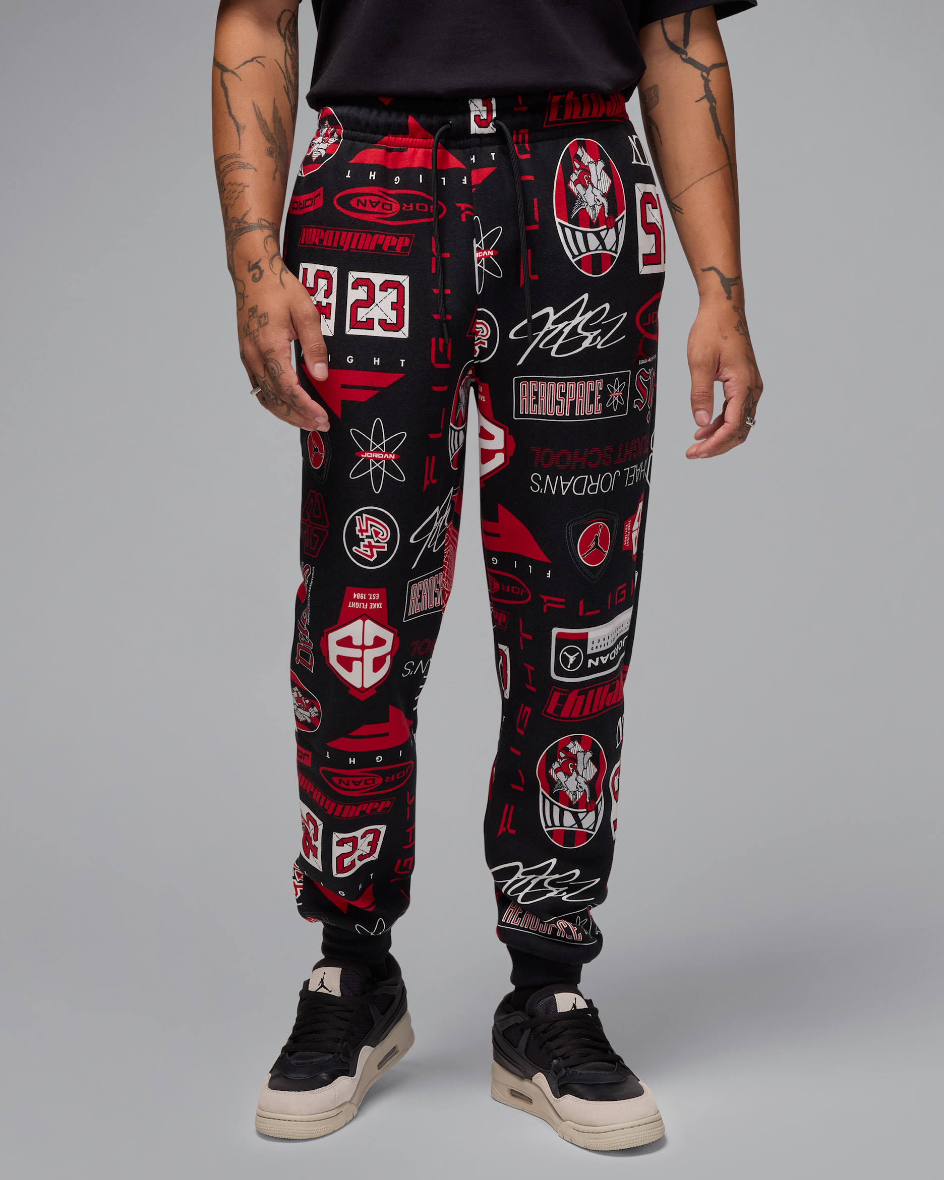Jordan Essentials Men's Printed Fleece Pants - Black/Varsity Red
