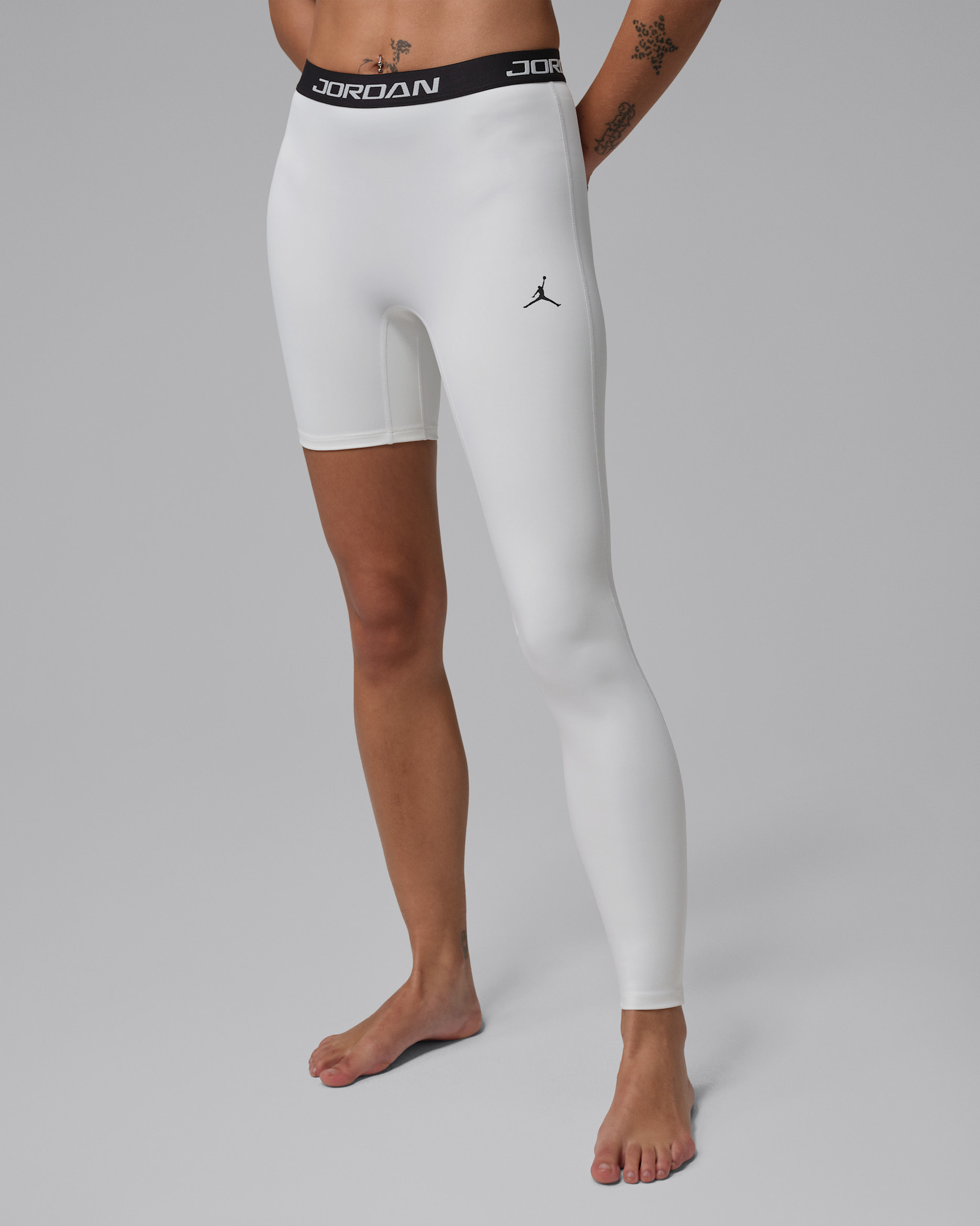 Jordan Sport basketballegging met hoge taille en enkele pijp voor dames (links) - Wit/Zwart