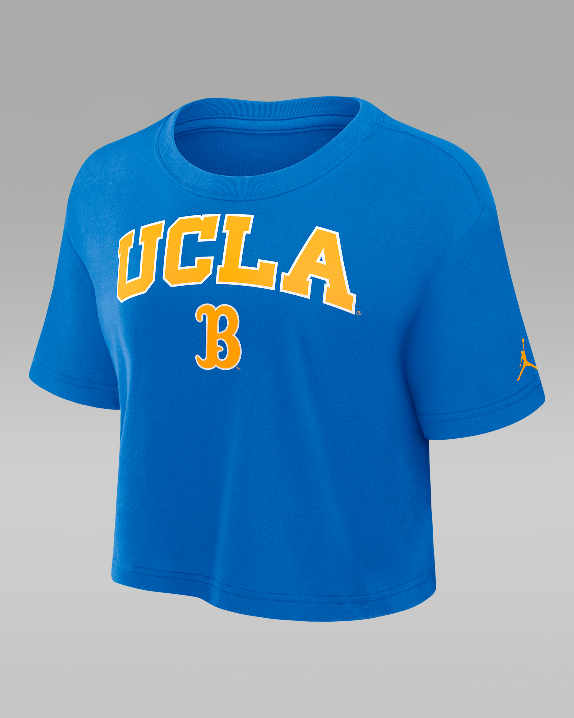 Playera universitaria marca Jordan Dri-FIT cropped para mujer UCLA Athletic Prep Arch - Azul