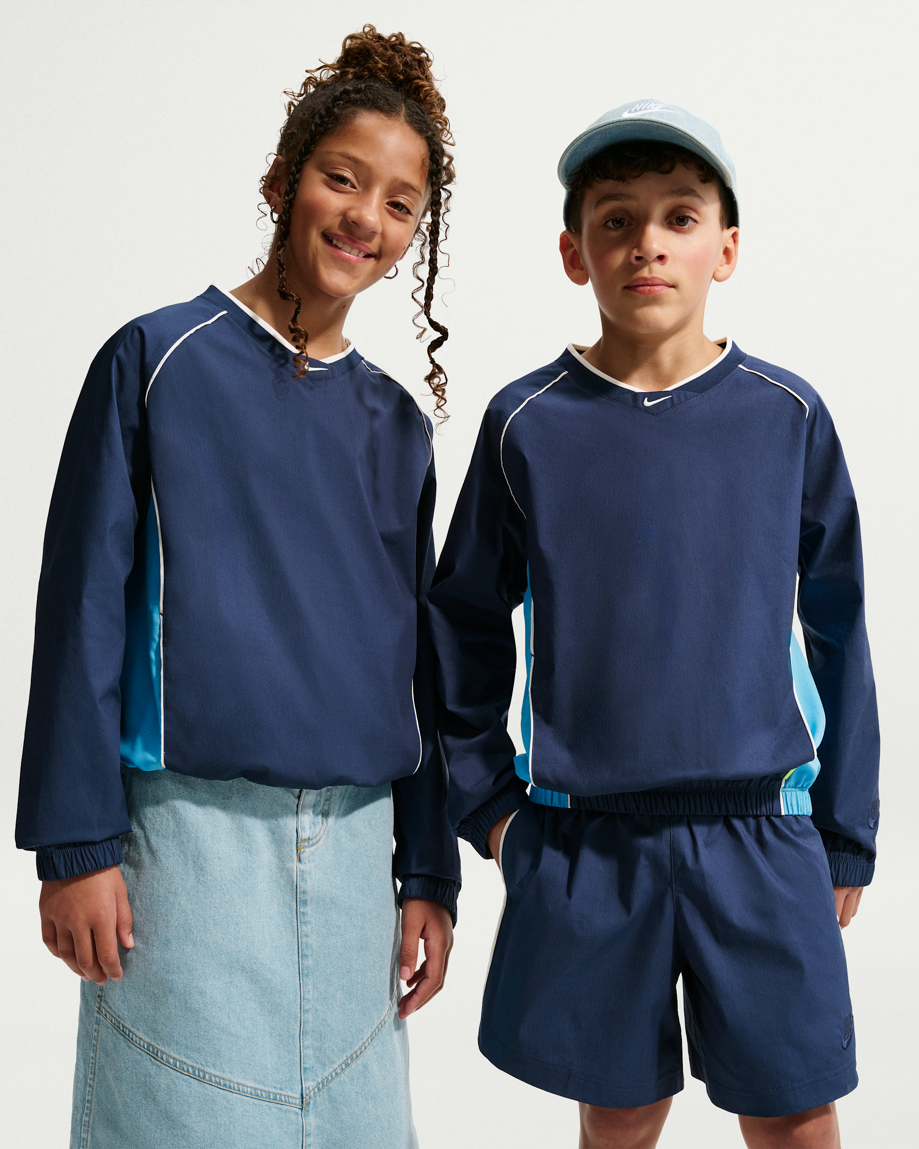 Nike Sportswear Big Kids' Woven V-Neck Long-Sleeve Top - Midnight Navy/University Blue/Soft Pearl/Midnight Navy