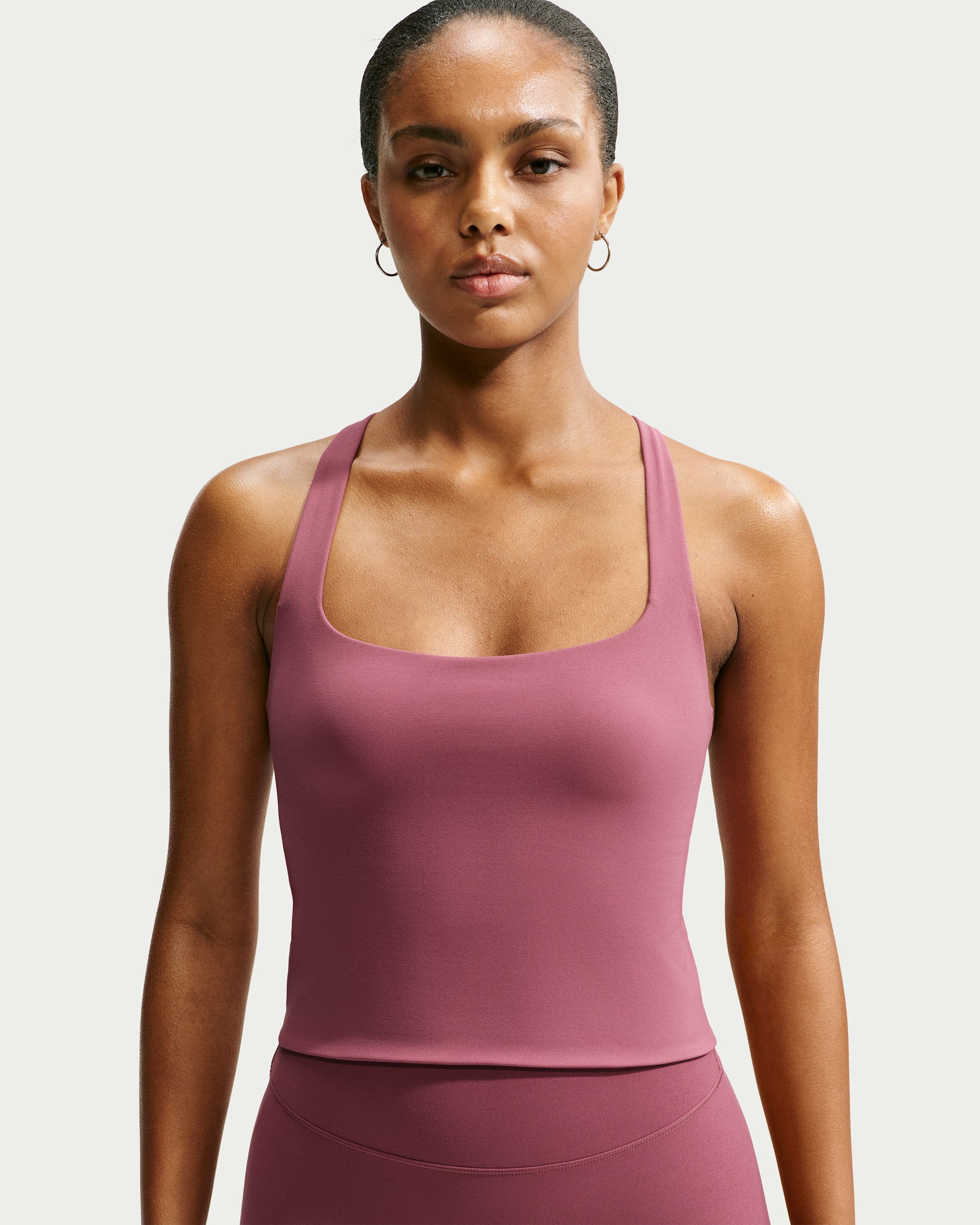Camiseta de tirantes con bra deportivo de baja sujeción para mujer Nike Zenvy - Rosa humo/Blanco