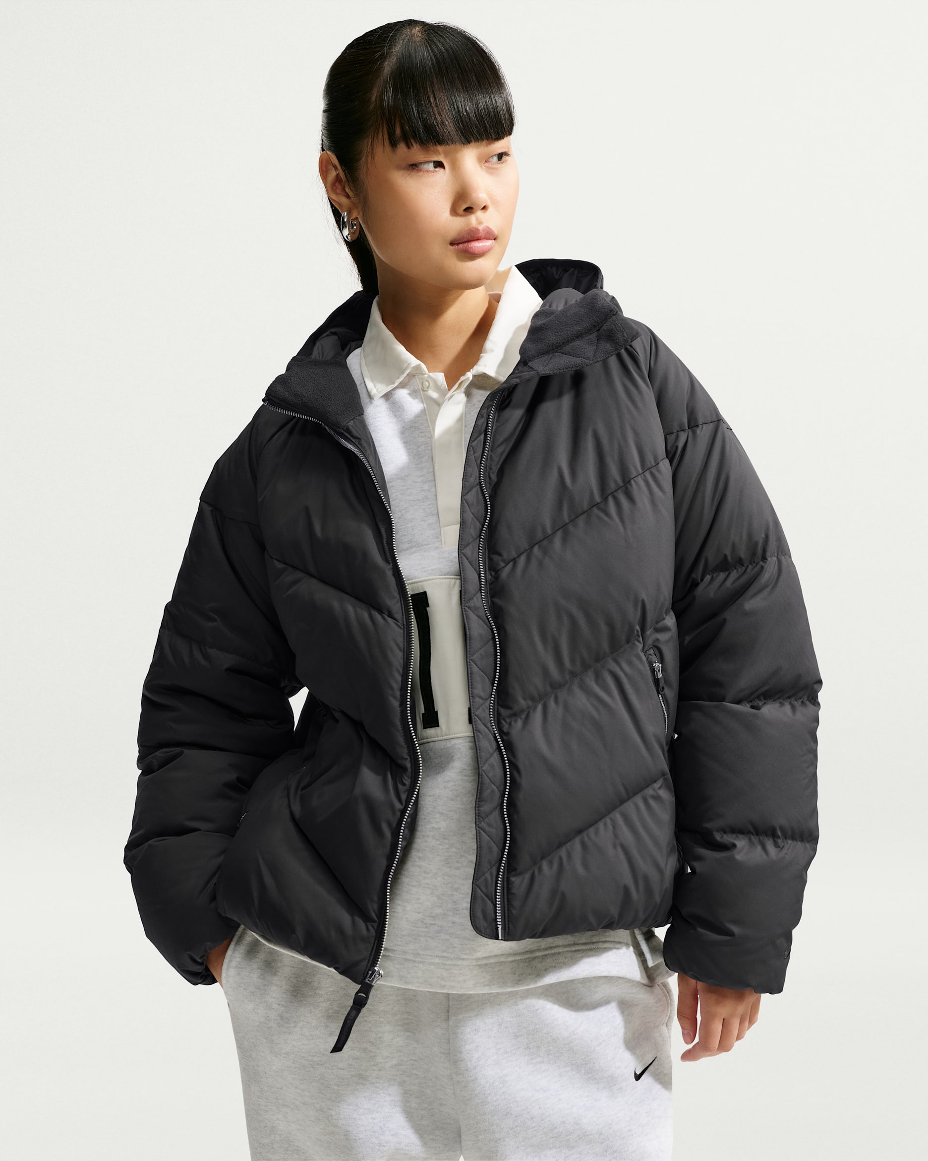 Giacca in piumino ampia con cappuccio Storm-FIT Nike Sportswear Windpuffer – Donna - Nero/Nero