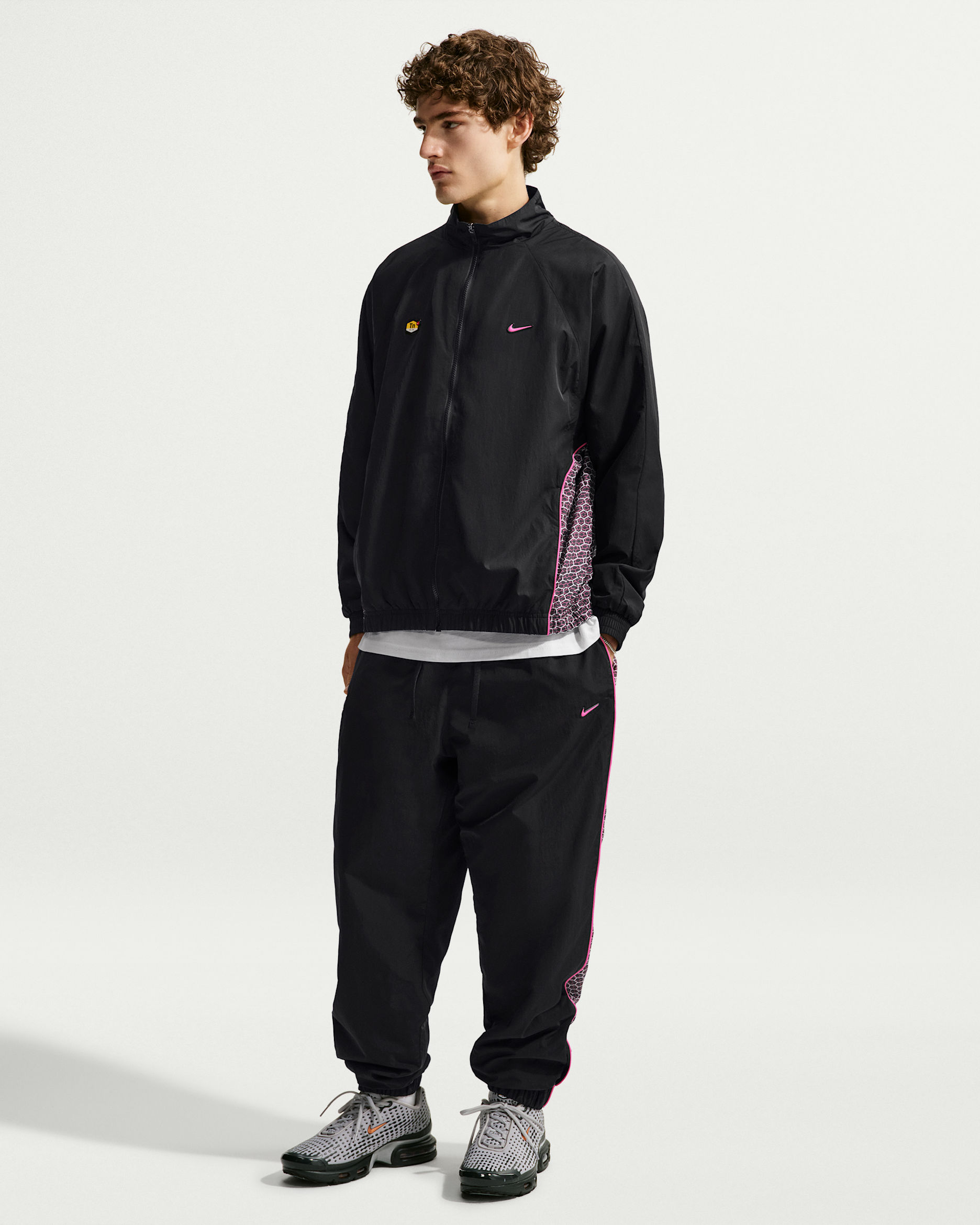 Pantaloni in tessuto Nike Sportswear – Uomo - Nero/Nero/Pinksicle