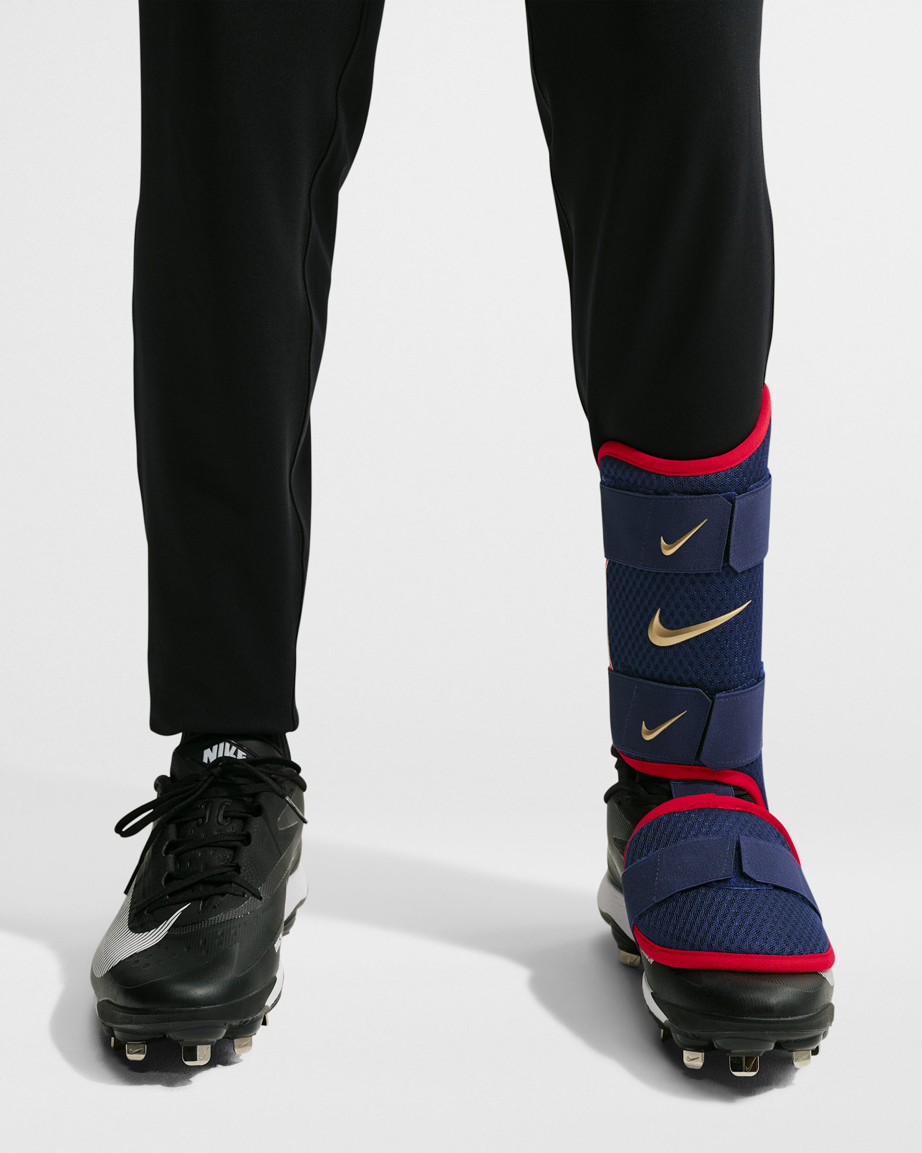 Protección de pierna para bateador de béisbol Nike Diamond (bateador zurdo) - Azul vacío/Pimiento/Oro metalizado
