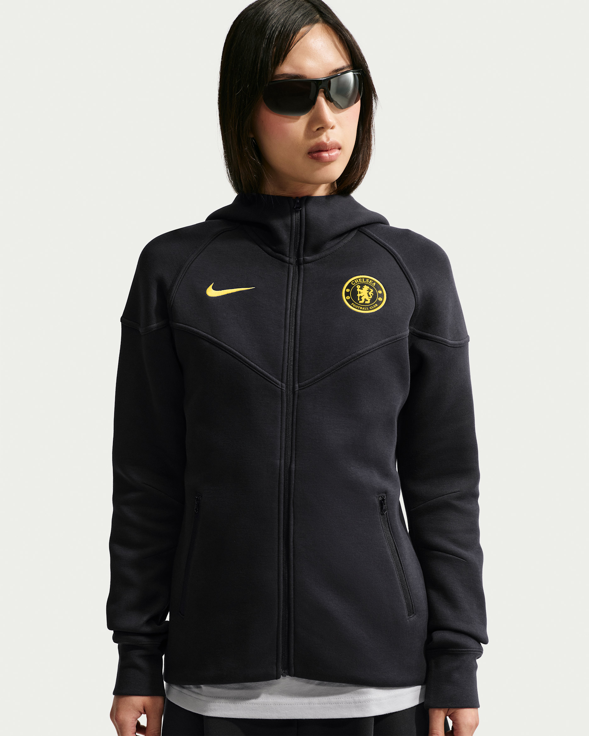 Damska bluza do piłki nożnej z kapturem i zamkiem na całej długości Nike Chelsea F.C. Tech Fleece Windrunner - Pitch Blue/Midwest Gold