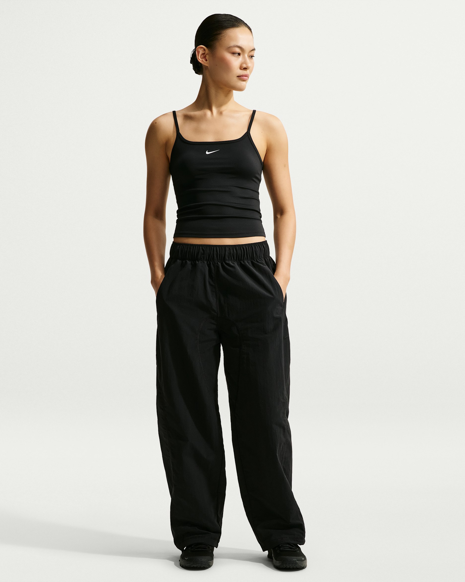 กางเกงขายาวผ้าทอเอวปานกลางผู้หญิง Dri-FIT Nike N.A.C. - ดำ/ดำ
