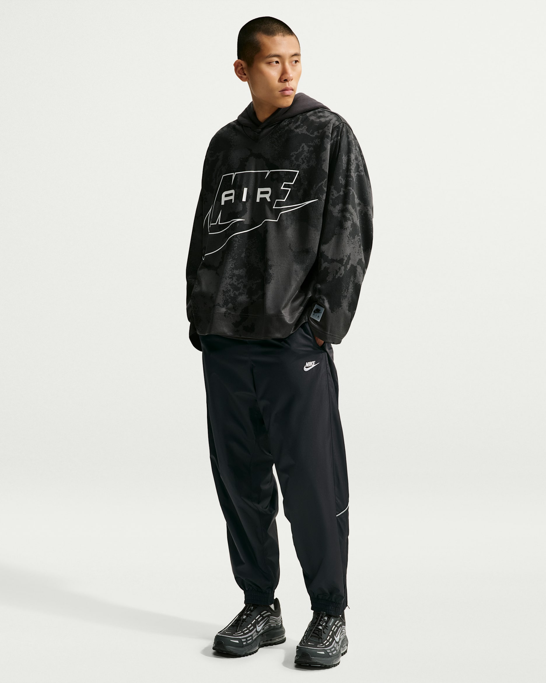 Pantalon à l'épreuve des intempéries Nike Windrunner pour homme - Noir/Noir/Blanc