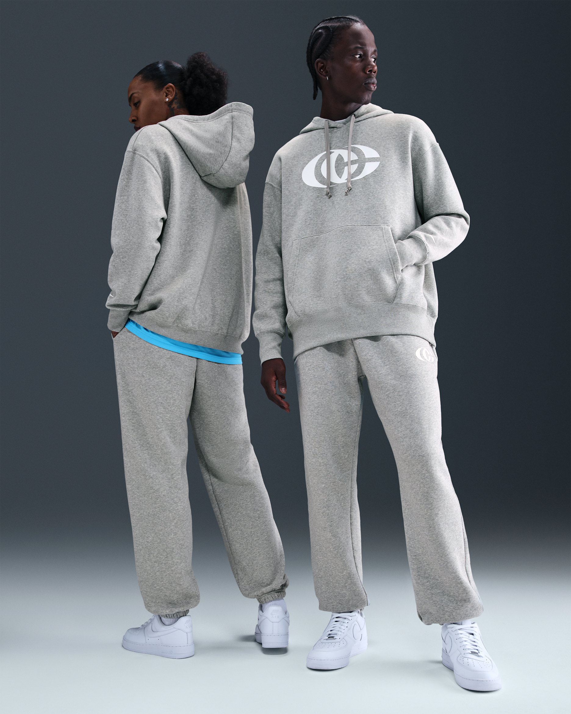 Pants de tejido Phoenix Fleece Nike Básquetbol Caitlin Clark - Gris oscuro jaspeado/Blanco/Blanco