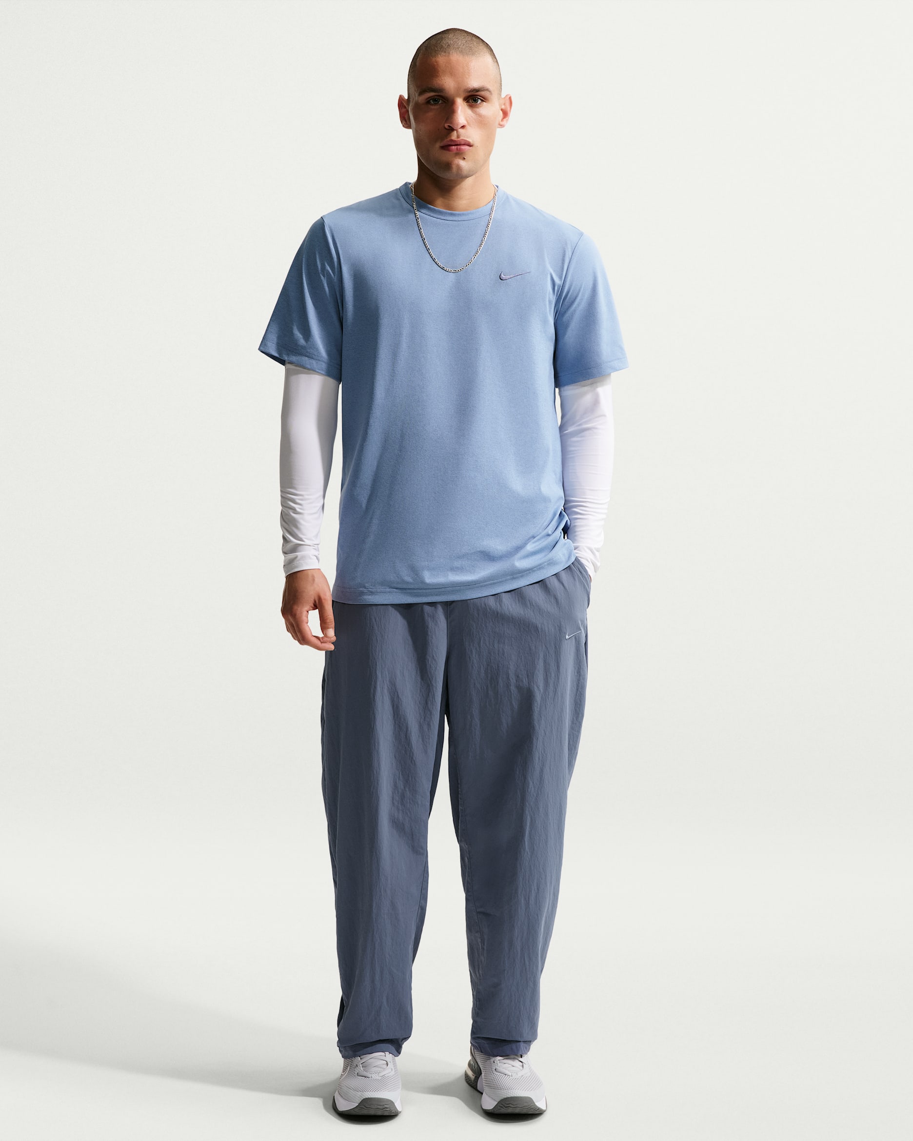 Pánské tkané tréninkové kalhoty Nike NAC Dri-FIT - Diffused Blue/Pale Ivory/Diffused Blue