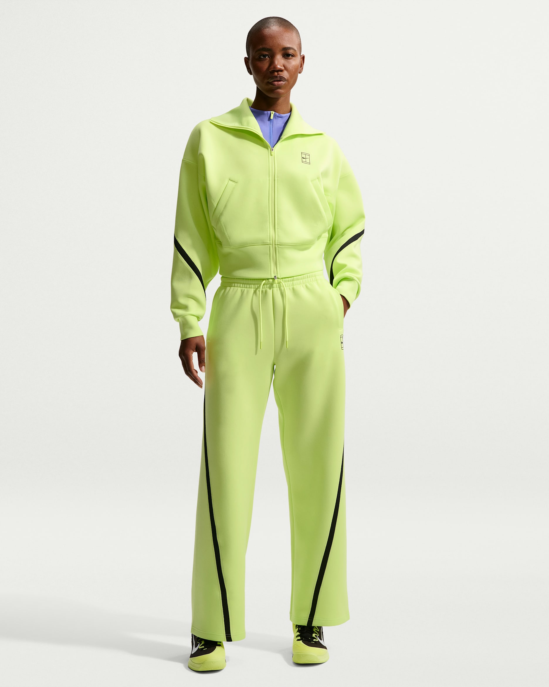 Nike Advantage Dri-FIT tennisbukse med mellomhøyt liv til dame - Light Lemon Twist/Svart