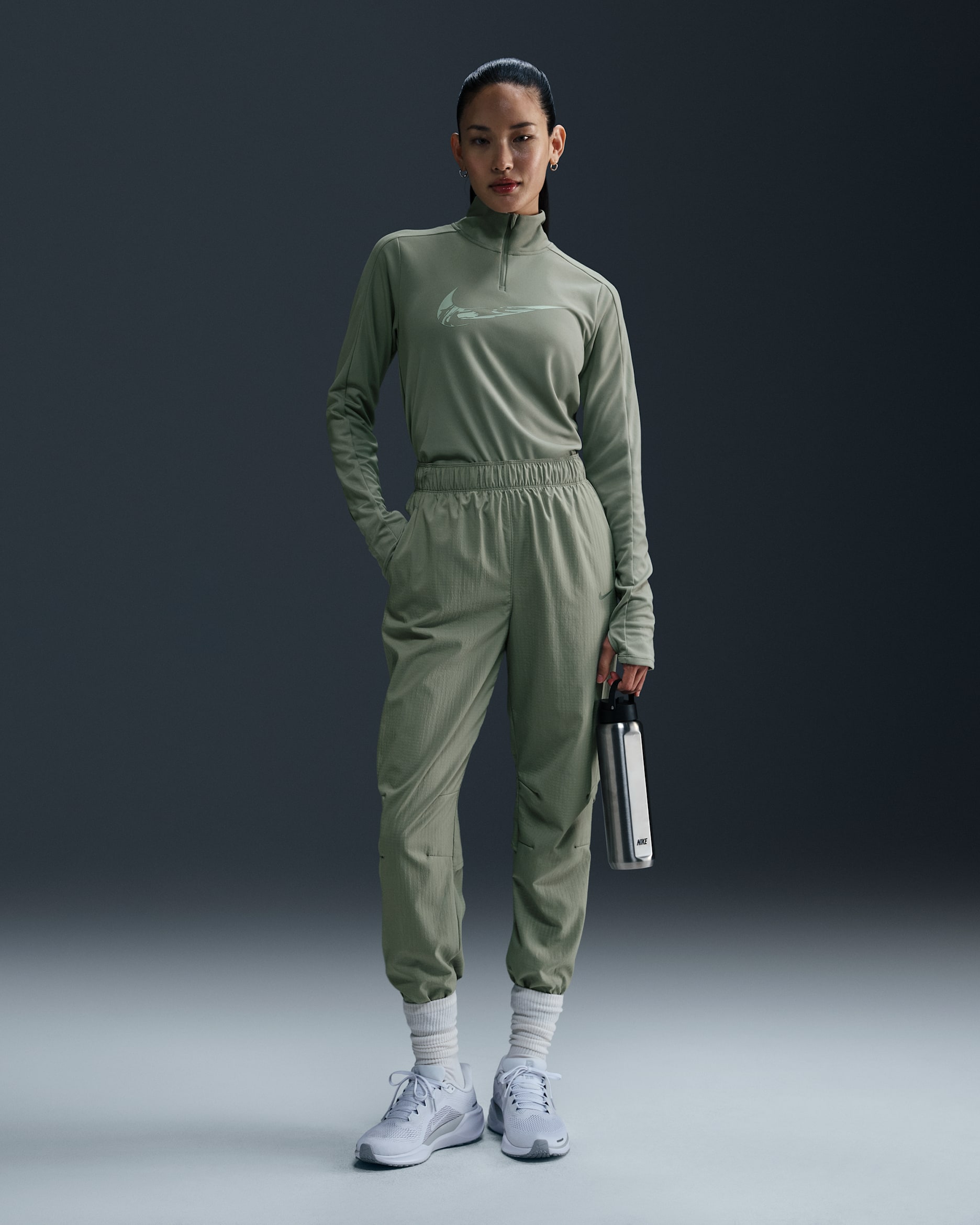 Nike Dri-FIT Fast-opvarmningsbukser i 7/8 længde med mellemhøj talje til kvinder - Jade Horizon