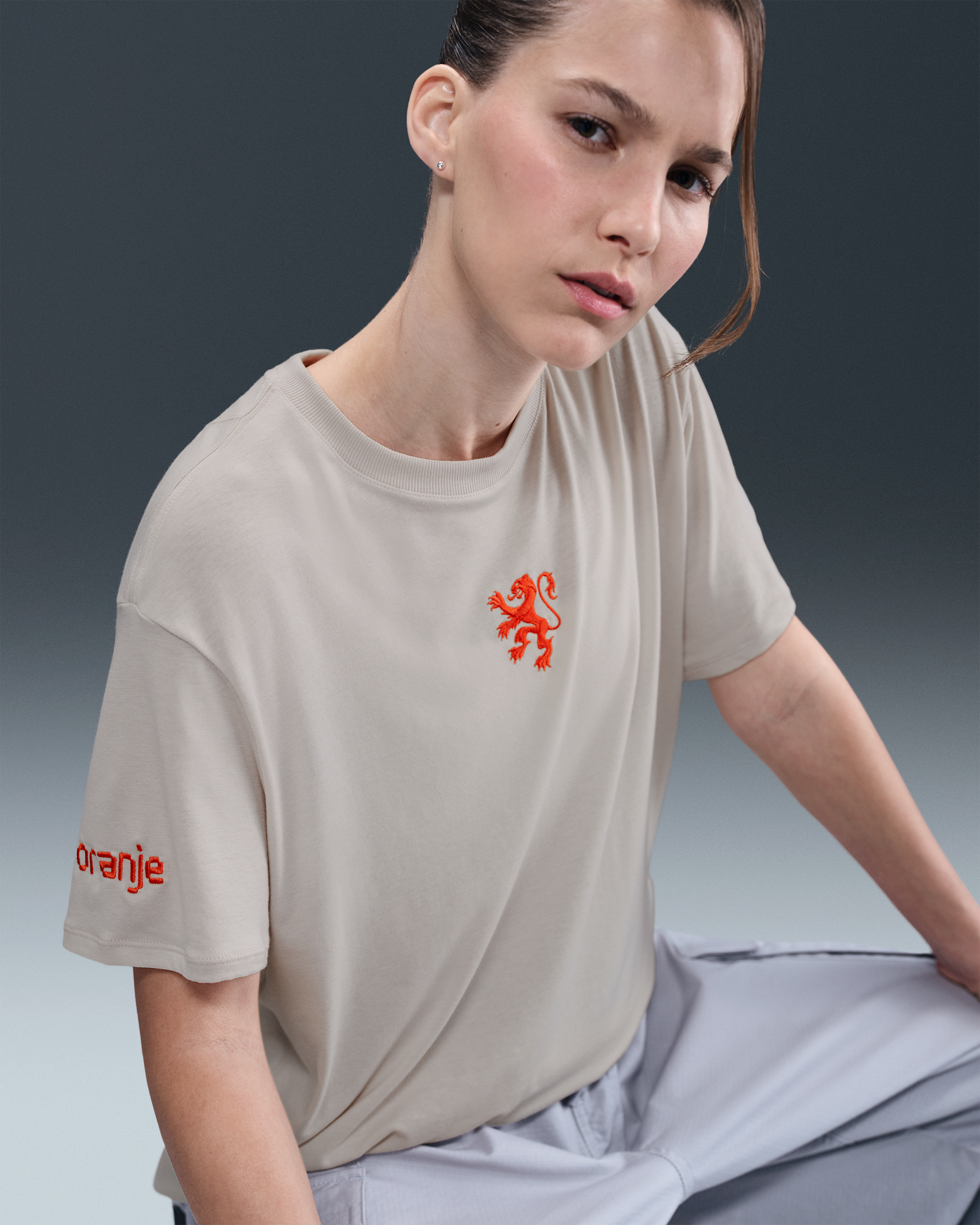 Netherlands Relaxed Women's Nike One Dri-FIT Football Short-Sleeve Top - Light Orewood Brown/Safety Orange/White