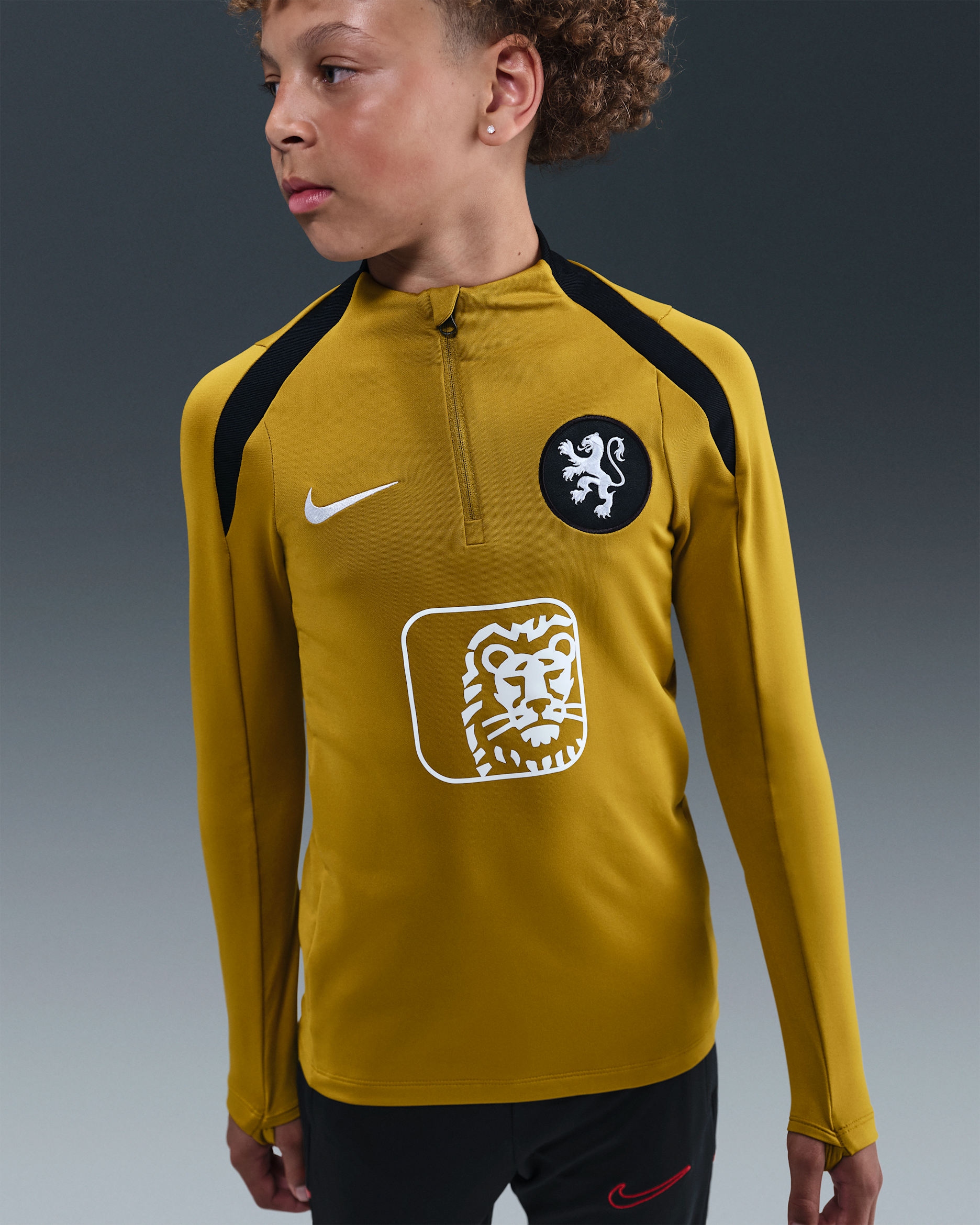 Netherlands Strike Older Kids' Nike Dri-FIT Football Drill Top - Bronzine/Black/White