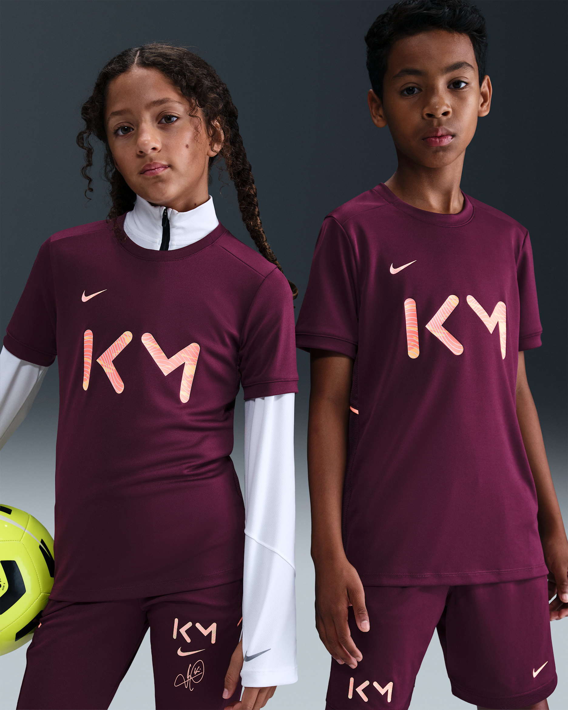 Kylian Mbappé Academy Older Kids' Nike Dri-FIT Football Short-Sleeve Top - Bordeaux/Bordeaux/Orange Pulse/Melon Tint