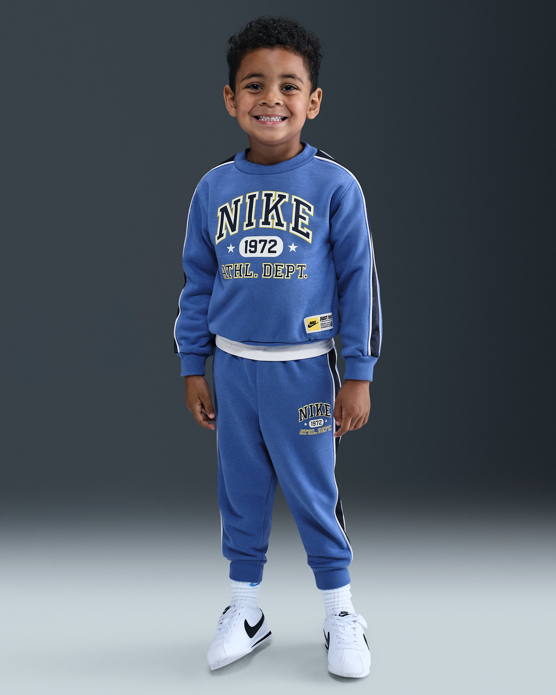 Nike Sportswear Toddler P.E. Conjunto de sudadera de cuello redondo y pants de French Terry para bebé (12 a 24 meses) - Azul cometa