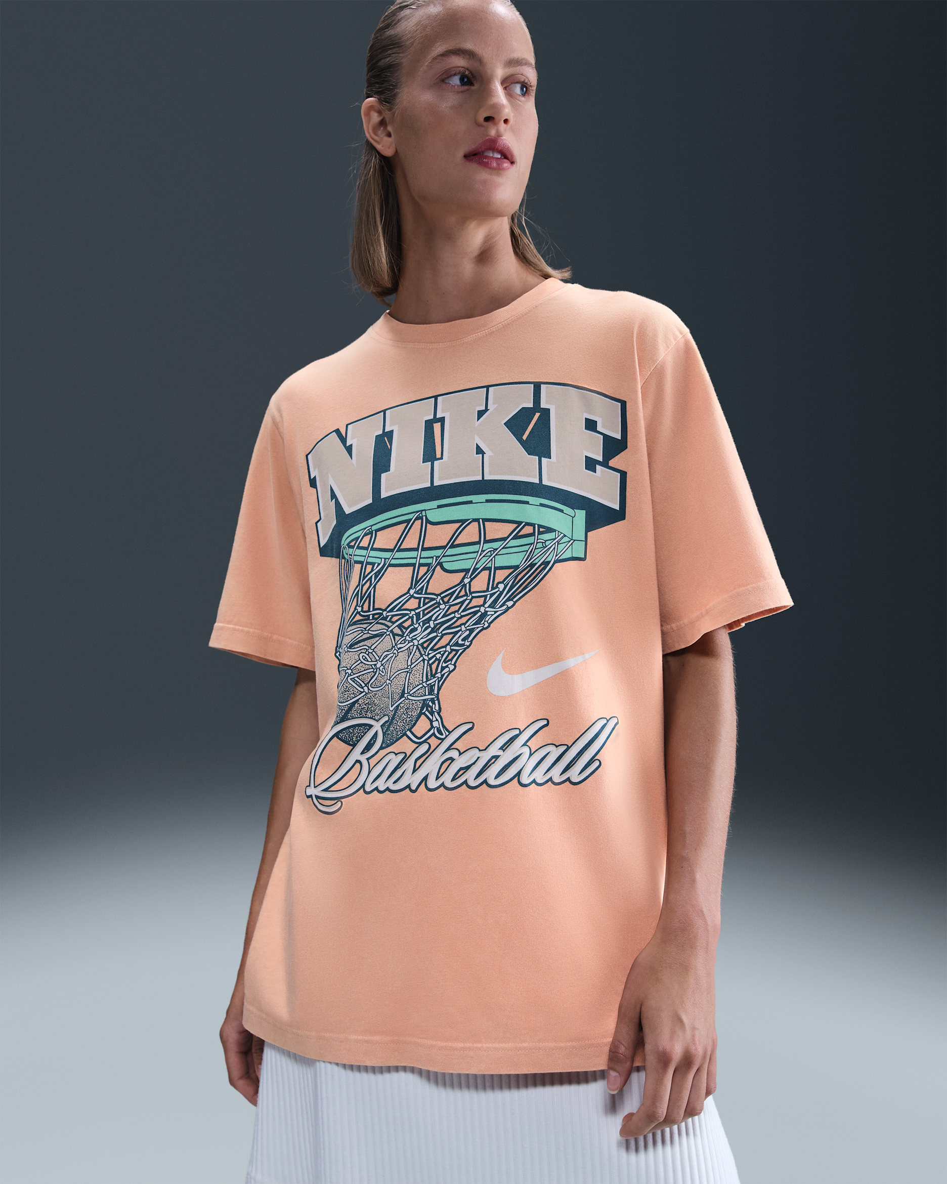 Playera de básquetbol con gráfico holgada para mujer Nike - Oro rosa