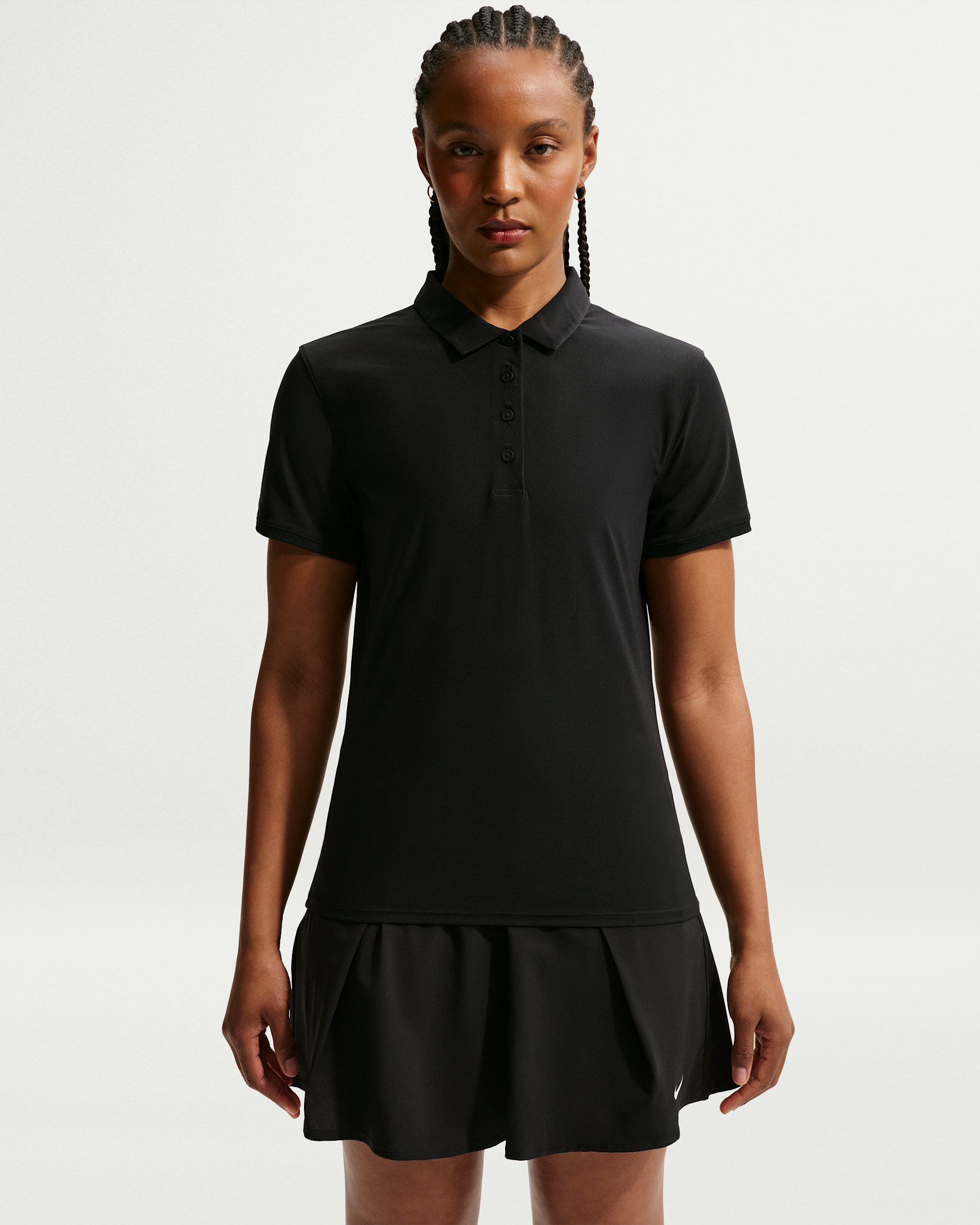 Black short-sleeve performance polo with a folded collar and button placket