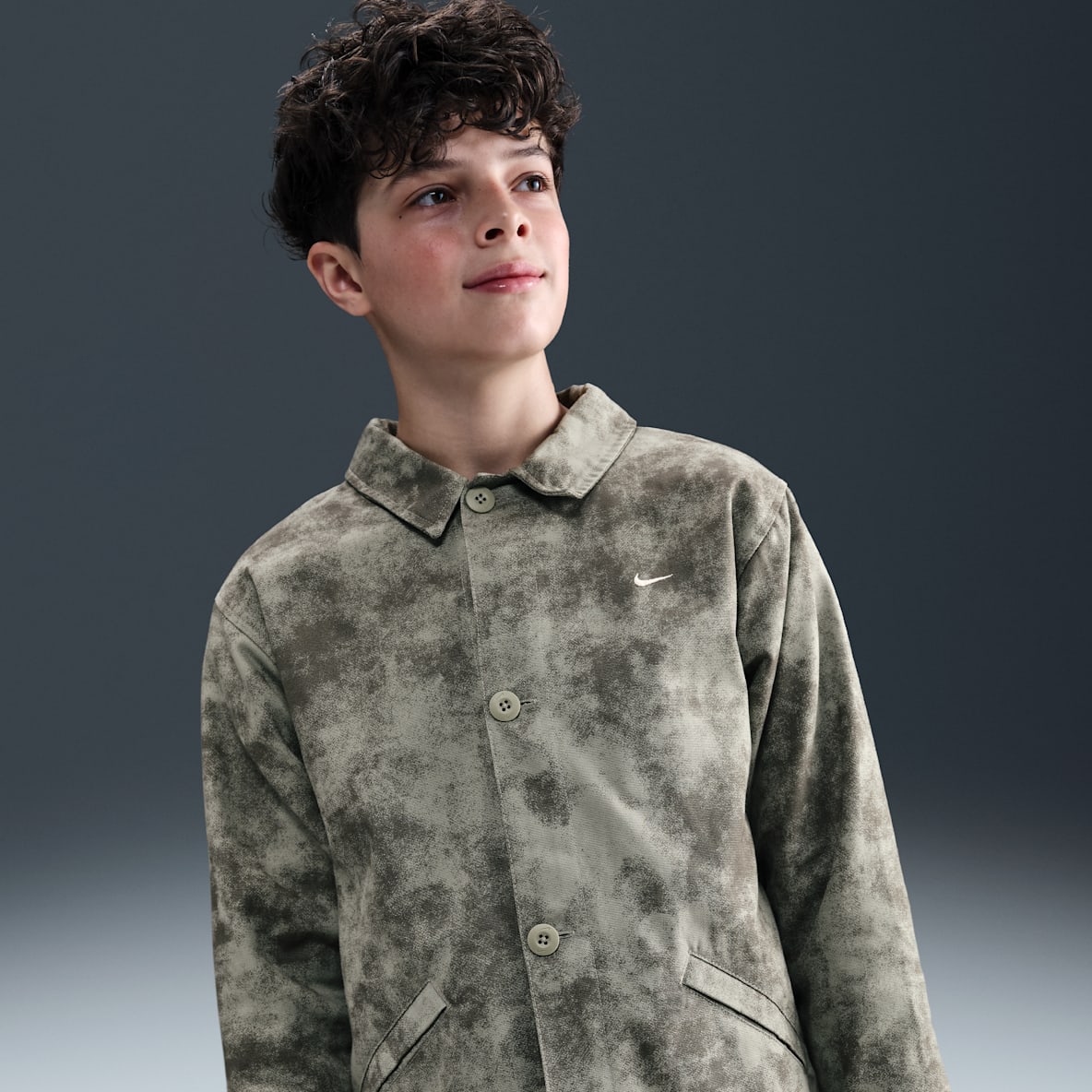 Nike Sportswear Metro Ground Nike Sportswear Metro Ground เสื้อติดกระดุมเด็กโต (ชาย)