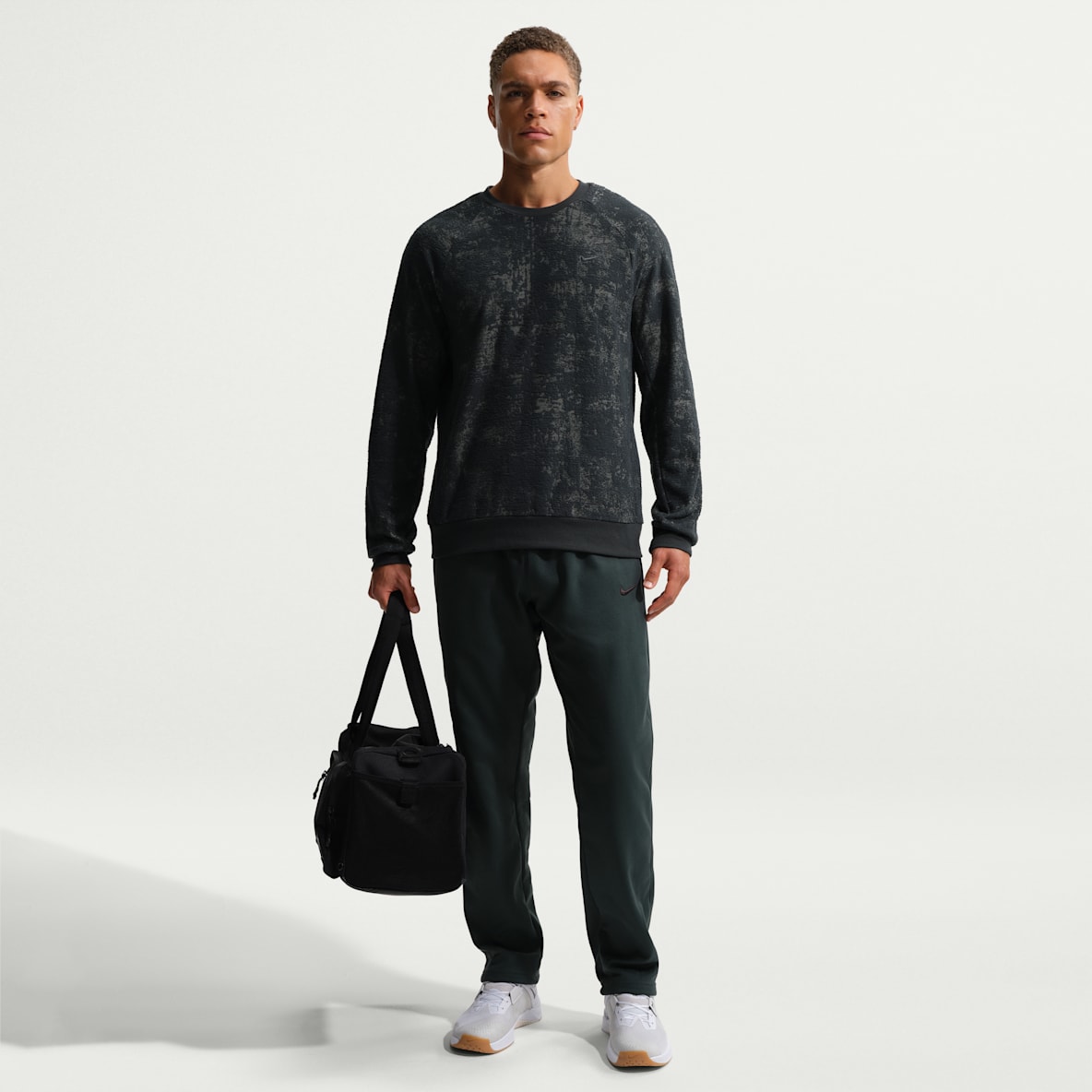 Nike Therma Pants de fitness Therma-FIT con dobladillo abierto para hombre